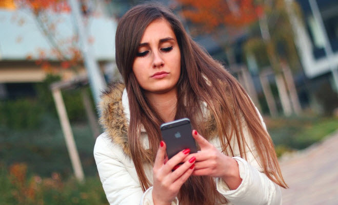 Woman reading text message