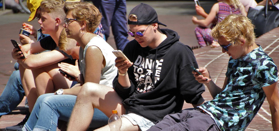 Students with mobile phones
