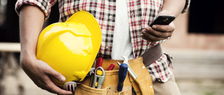 Employee repair man reads text message