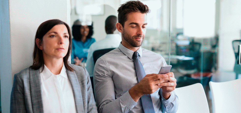 job-applicants-waiting-for-interview-while-sitting-young-man-texting