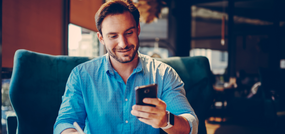 Man reading text message - SMS marketing