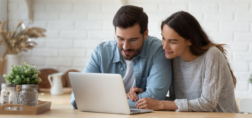 young couple browsing web stores