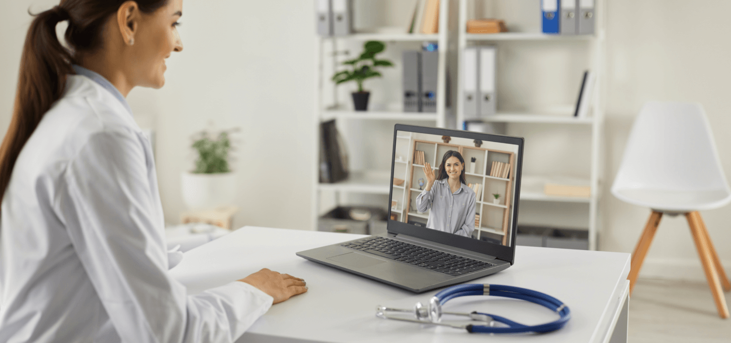Image of a doctor engaging in a telehealth  video consultation with a patient