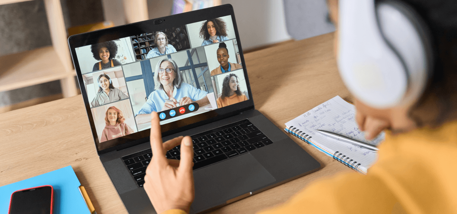 Image of a teacher and her students engaging in a virtual class over a video call